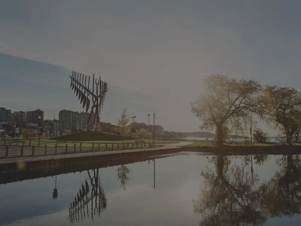 Barrie waterfront Spirit Catcher sculpture at sunrise representing local Simcoe County mortgage services